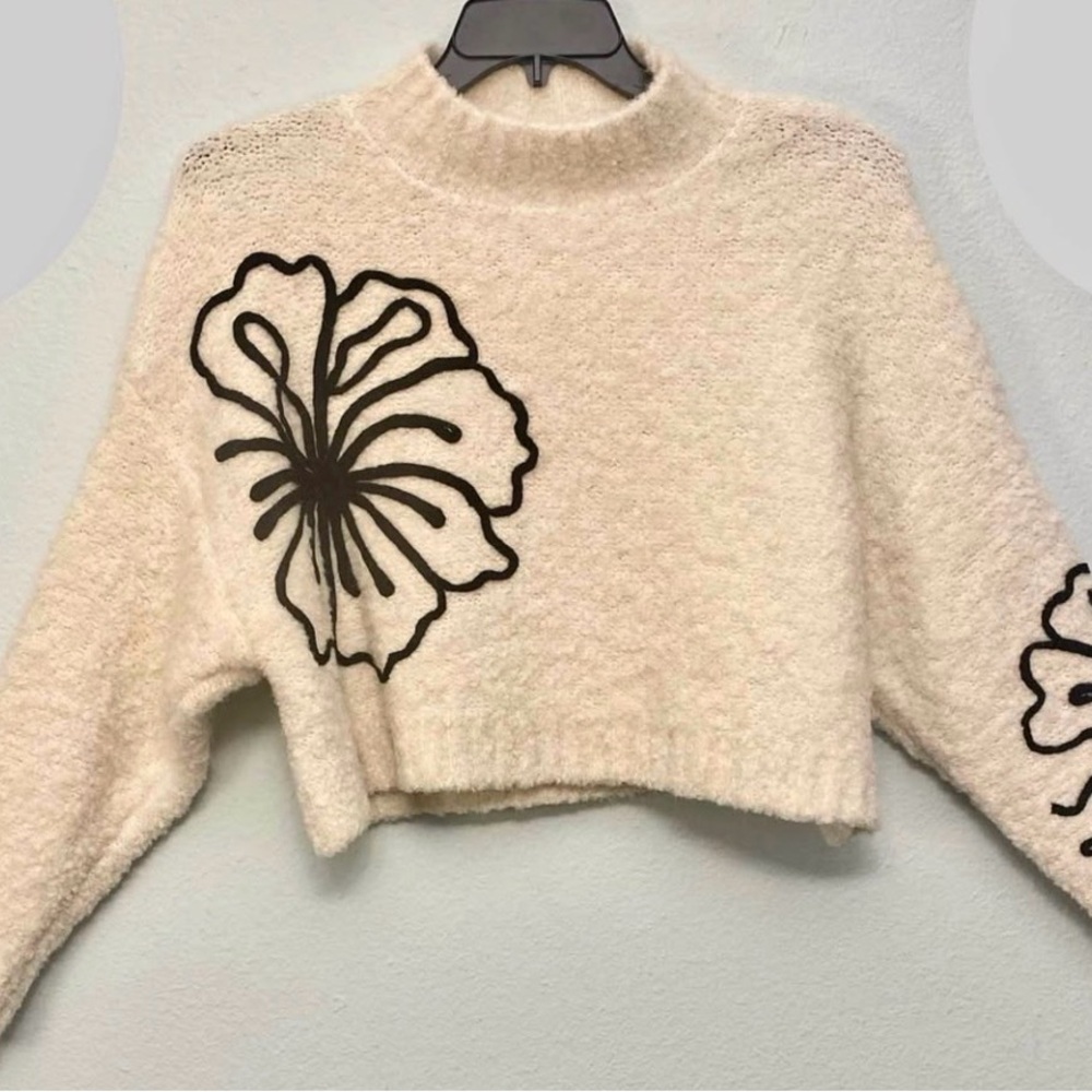 Cozy Cream Sweater with Floral Design